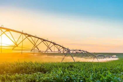 Irrigation being deployed in a field. Image purchased from Shutterstock.