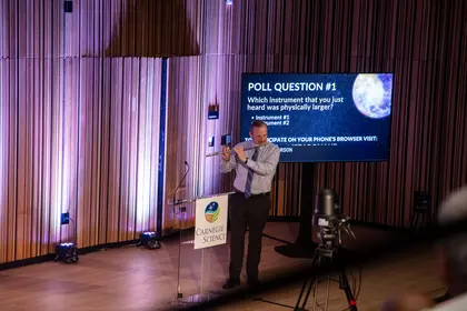 Karsten Halusa demonstrates the sound of a flute at the Kavli Prize Laureate program on starquakes