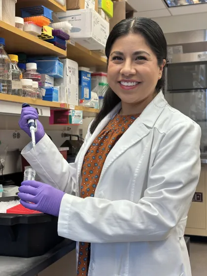 Karina Gutierrez Garcia in the lab with a pipette