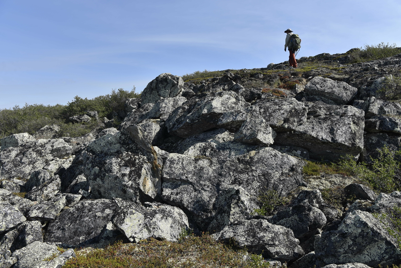 A researcher conducting fieldwork at the Slave Craton, Canada