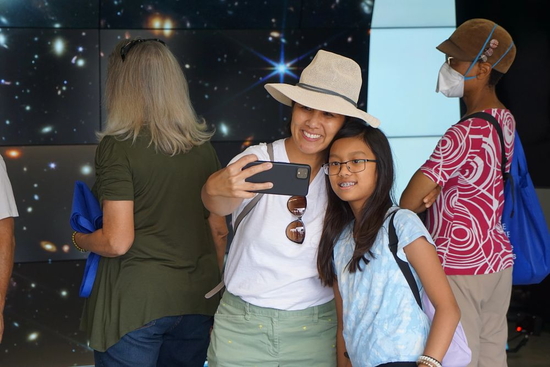 Visitors take a selfie in front of the VizLab at the Carnegie Observatories Open House, 2022