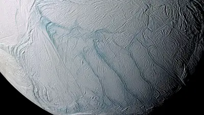 An enhanced color image of the south pole of Saturn’s moon, Enceladus, with the five parallel fissures in the surface, named the Tiger Stripes, clearly visible. This image is a mosaic of 21 false-color frames taken during the Cassini spacecraft’s close fly-by mission on March 9 and July 14, 2005. Image credit: NASA/JPL/Space Science Institute