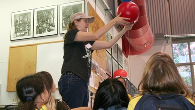 A STEM girls group visits the Carnegie Observatories' machine shop
