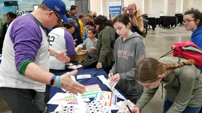 Making pocket Solar Systems at Carnegie's booth at the USA Science & Engineering Festival