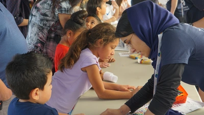 Young Open House attendees participate in an activity