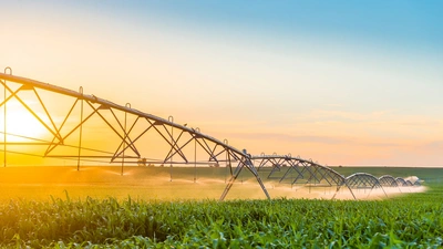 Irrigation being deployed in a field. Image purchased from Shutterstock.