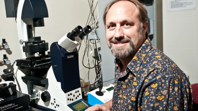 David Ehrhardt at a microscope.
