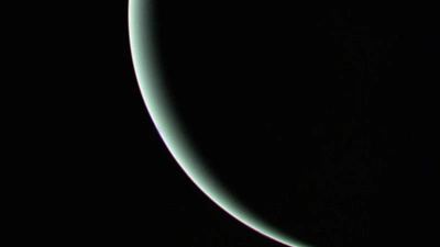 The view of Uranus recorded by Voyager 2 on January 25, 1986, as the spacecraft left the planet behind and set forth on the cruise to Neptune.