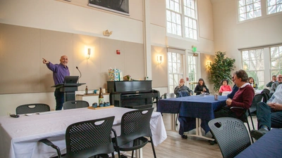 Mike presents at Bjorn and Susana's Retirement Party