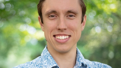 Vasilije Headshot green background