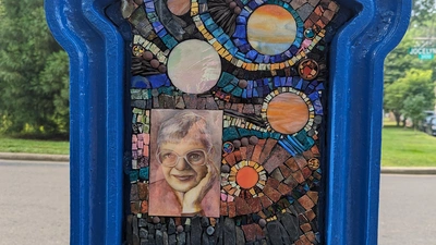 Call Box Art - Brightly colored mosaic with space themes and a portrait of Vera Rubin