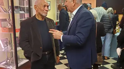 Former NASA Administrator Charles Bolden and Carnegie President Eric D. Isaacs converse during the pre-screening reception for The Space Race