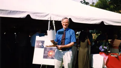 Sean Solomon with a model of the MESSENGER craft, 1999