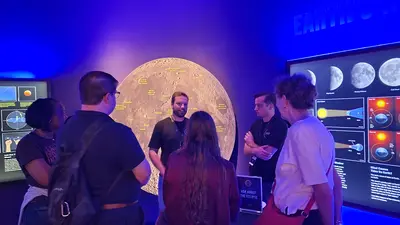 Carnegie Science volunteers at the Perot Museum answering questions about the eclipse