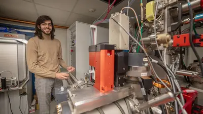 Julien Rojas loads a sample into the press