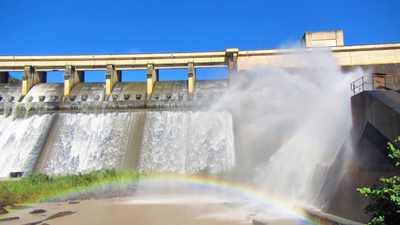 Rainbow in front of a dam wall. Shot in Hazelmere Dam Nature Reserve, near Durban, North Coast of Kwazulu-Natal, South Africa.