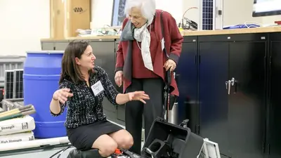 Maxine Singer learns about seismometers from Diana Roman