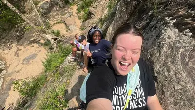 2024 Interns take a selfie whileHiking at Grat Falls