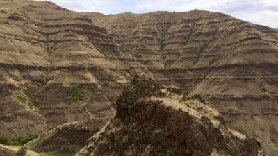 A dike (forground) in the Chief Joseph Dike Swarm was one ofmany that sourced the Grande Ronde Basalt, the most voluminous formation of the Columbia River Basalt Group (Photo credit: Jennifer Kasbohm).