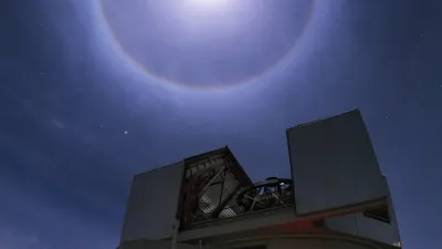 The moon with a cloudy halo over the Magellan Clay telescope at Carnegie Science's Las Campanas Observatory. Courtesy Yuri Beletsky