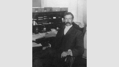 Frederick V. Coville seated at his desk