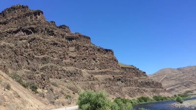 This pile of lava flows is part of the Grande Ronde Basalt, the most voluminous formation of the Columbia River Basalt Group (Photo credit: Jennifer Kasbohm).