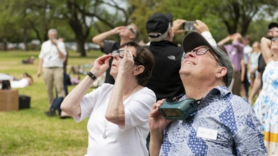 Carnegie Champions Cynthia Kurtz and Jim McDermott observe the 2024 Great North American Eclipse in Dallas, TX.