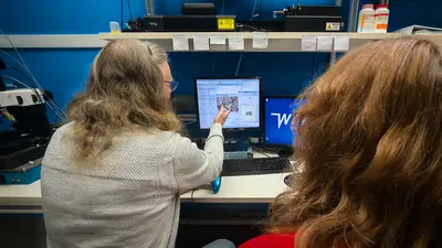 Steele points to a sample of Martian meteorite 