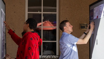 Poster session preparations during the Workshop on Information, Selection, and Evolution (WISE).