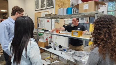 Machine Shop Foreman Vince Kowal gives a tour of the Observatories Machine Shop to CASSI interns. 