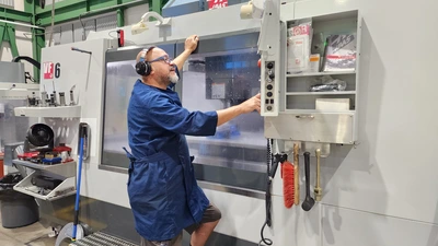 Instrument Maker and CNC Machinist Jerson Castillo at work in the Observatories Machine Shop. 
