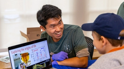 Mike Wong engages with a neighborhood child during the inaugural EPL Open House in the fall of 2025.