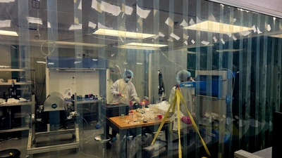 Jason Williams works on the Henrietta spec clean room at the Observatories.
