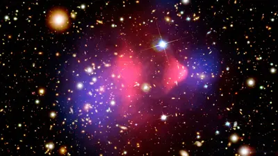 Image credit: The Bullet Cluster X-ray: NASA/CXC/M. Markevitch et al.; Optical: NASA/STScI; Magellan/U. Arizona/D. Clowe et al.; Lensing Map: NASA/STScI; ESO WFI; Magellan/U. Arizona/D. Clowe et al.