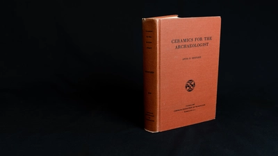 Red book on black backdrop. "Ceramics for the archaeologist"