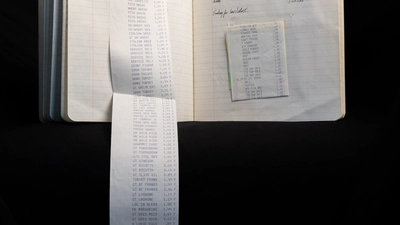 A receipt unfurls from the Lunch Club notebook. 