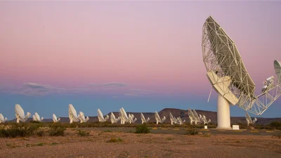 The MeerKAT telescope is an array of 64 interlinked receptors (a receptor is the complete antenna structure, with the main reflector, sub-reflector and all receivers, digitisers and other electronics installed).