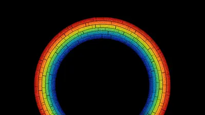 A rainbow arc against a black background. 