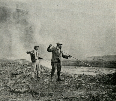 Investigators collecting gases in soft-nosed tubes at Kilauea.