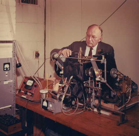 Charles Stacy French working with a machine at the Department of Plant Biology.