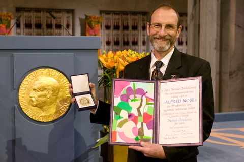 Carnegie's Chris Field poses with the 2007 Nobel Peace Prize awarded to the IPCC.