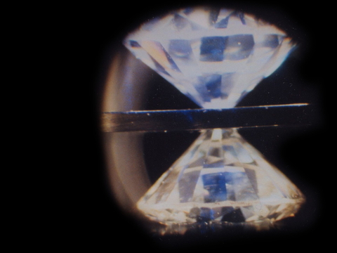 Two diamonds squeeze a material in a Diamond Anvil Cell