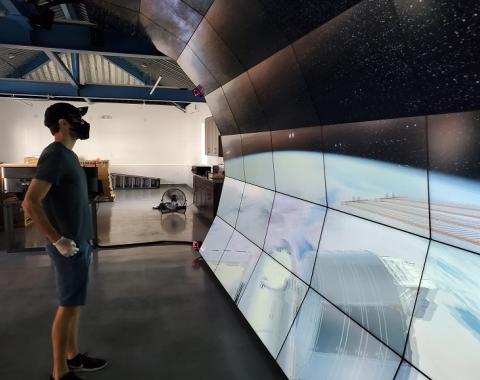 Carnegie theoretical astrophysicist Anthony Piro engages with a 3-D rendering of the International Space Station on the VizLab’s wall.