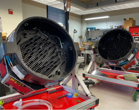 The twin FPS units (prior to robot installation). One of these goes to Carnegie's Las Campanas Observatory in the Southern Hemisphere and the other goes to Apache Point Observatory in the Northern hemisphere. Credit: The SDSS collaboration.