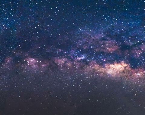 The Milky Way is visible in a starry sky. 