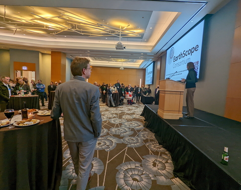 Lara Wagner stands at podium at EarthScope Reception