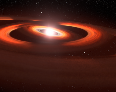 This artist's concept is based on Hubble Space Telescope images of gas-and-dust disks around the young star TW Hydrae. Hubble Space Telescope photos show shadows sweeping across the disks encircling the system. Credit: NASA, AURA/STScI for ESA, Leah Hustak (STScI).