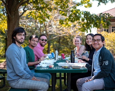 Enjoying Chilean food at a picnic table for Hispanic Heritage Month