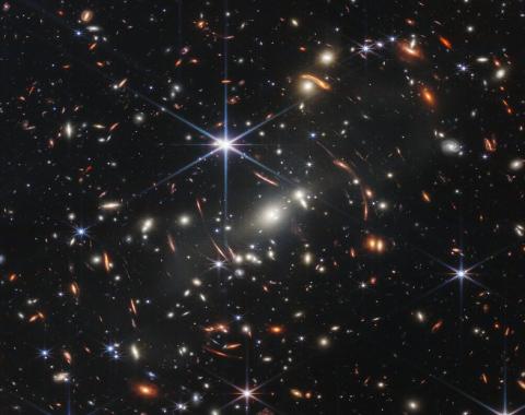 JWST Image of a foreground cluster gravitationally lensing background galaxies. Credits: NASA, ESA, CSA, and STScI