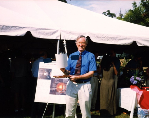 Sean Solomon with a model of the MESSENGER craft, 1999